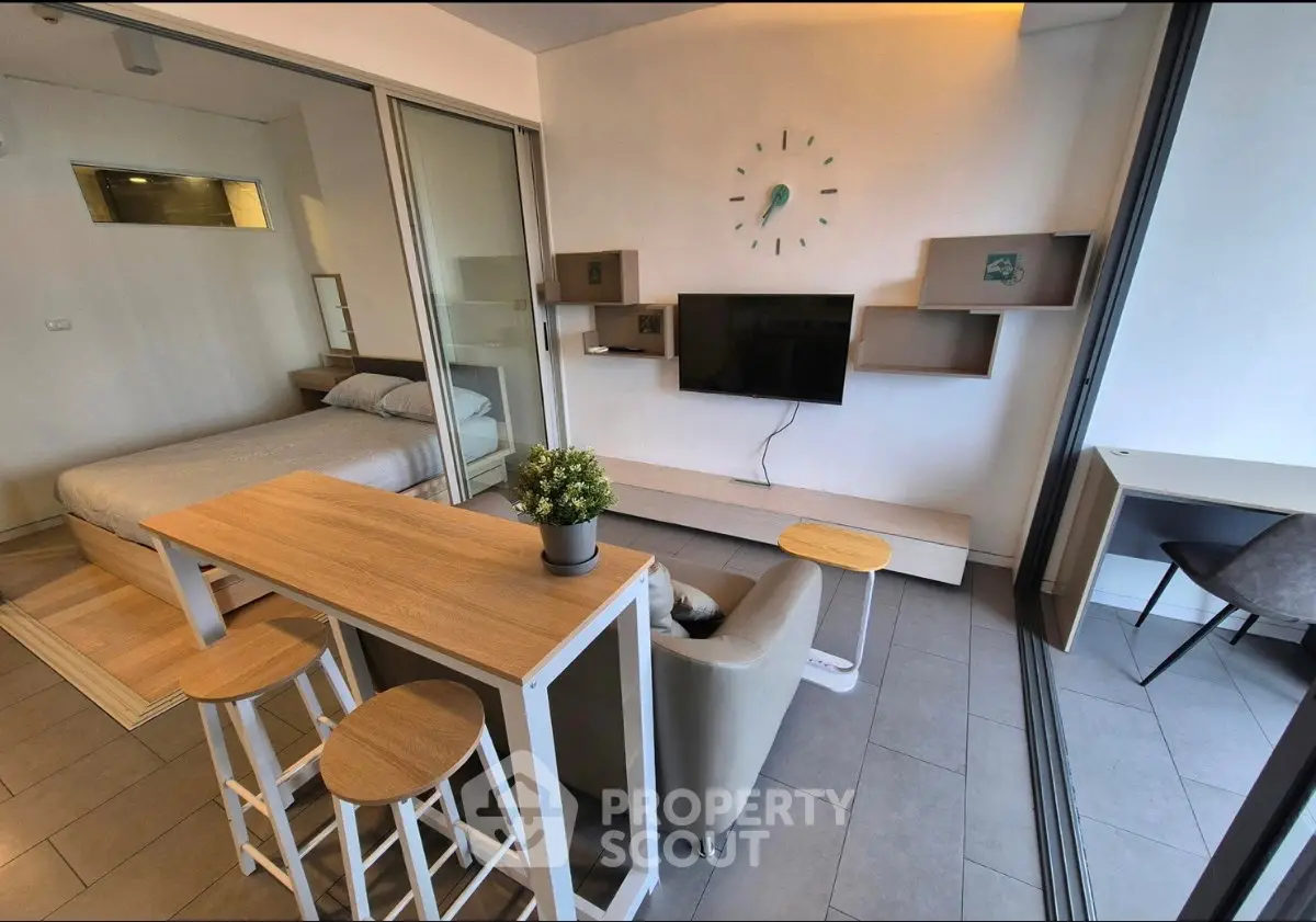 Modern studio apartment with open layout, stylish decor, and natural light.