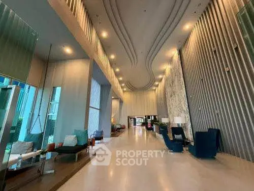 Luxurious modern lobby with high ceilings and elegant seating area
