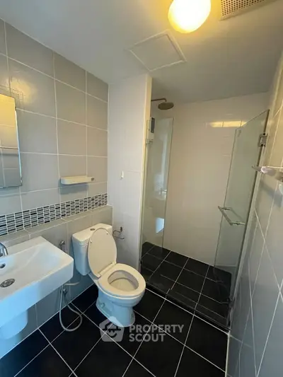 Modern bathroom with sleek design and glass shower enclosure