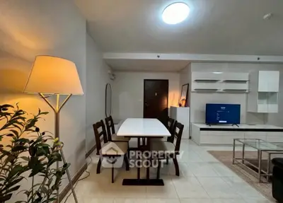 Modern living room with stylish furniture and ambient lighting, perfect for cozy gatherings.