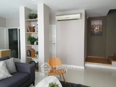 Modern living room with stylish decor and air conditioning