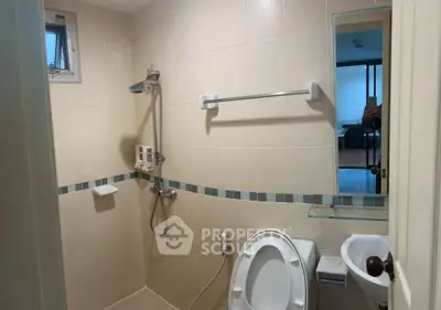 Modern bathroom with shower and toilet in a cozy apartment