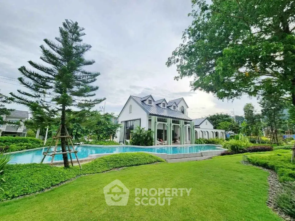 Luxurious villa with stunning pool and lush garden in serene setting