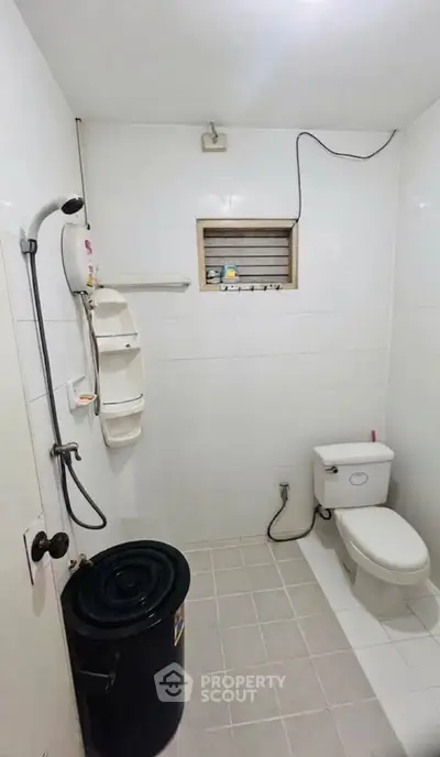 Simple bathroom with shower and toilet in a minimalist design