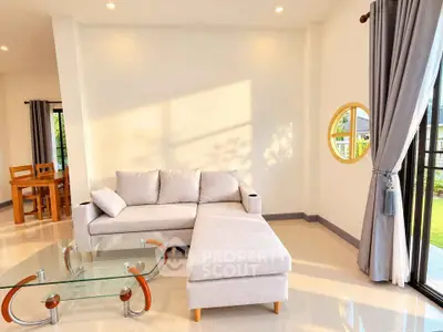 Bright and modern living room with elegant furniture and large windows