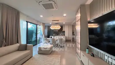 Luxurious open-plan living room with elegant dining area and modern decor