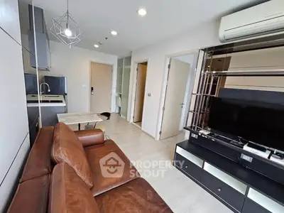 Modern living room with leather sofa and sleek entertainment center