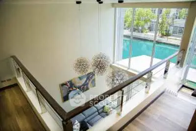 Stunning modern living room with large windows and waterfront view