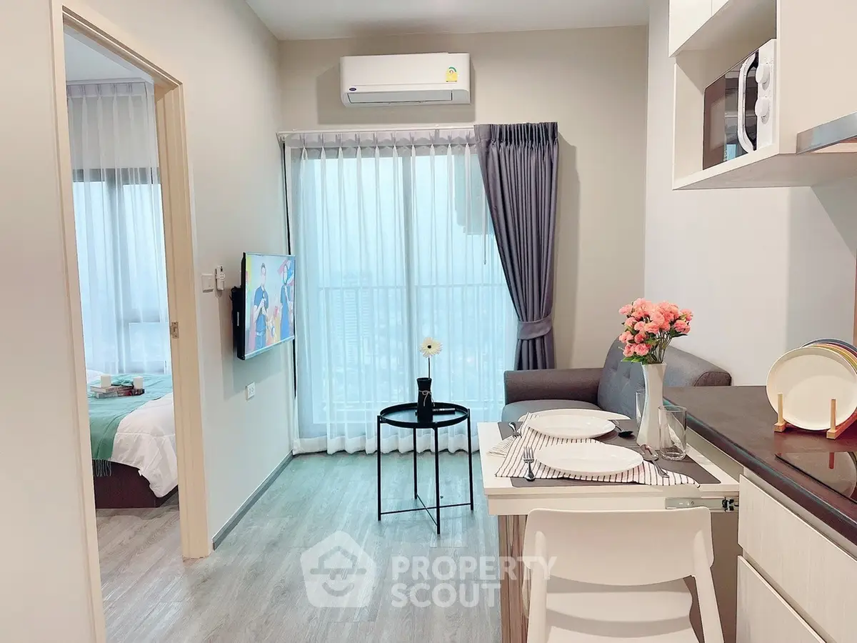 Modern apartment interior with cozy living room and dining area, featuring stylish decor and natural light.