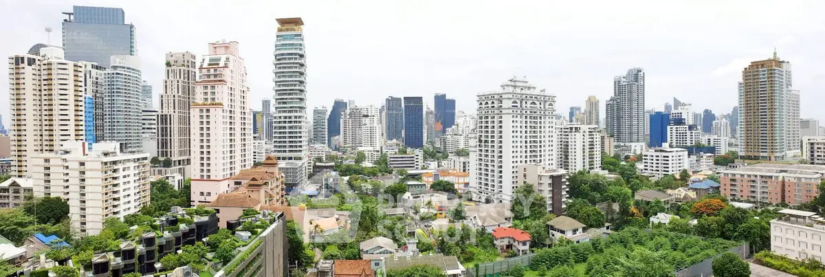 Stunning panoramic cityscape view showcasing modern skyscrapers and lush greenery, ideal for urban living.