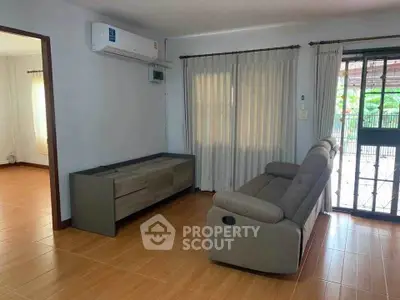 Spacious living room with modern sofa and natural light
