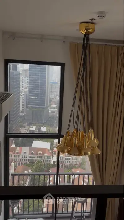 Luxurious high-rise apartment with stunning city view and elegant lighting fixture.