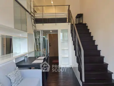 Modern loft apartment with mezzanine bedroom and stylish staircase