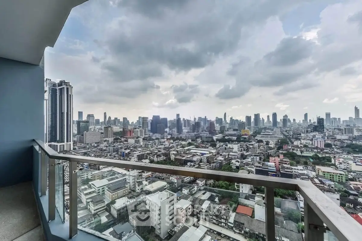 Stunning cityscape view from a high-rise balcony, showcasing urban skyline and vibrant city life.