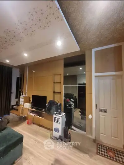 Spacious living room with modern decor and stylish ceiling design