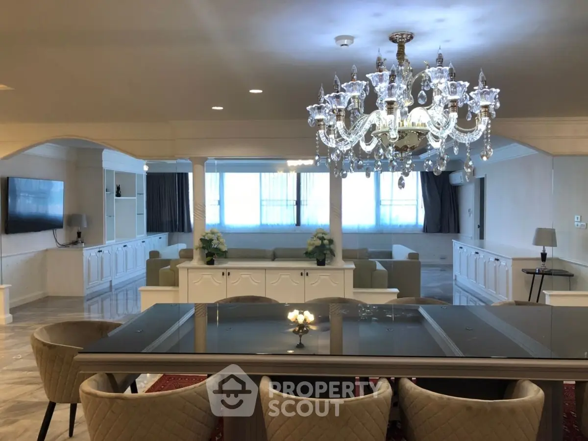 Luxurious living room with elegant chandelier and spacious seating area