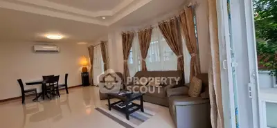 Spacious living room with elegant decor and natural light