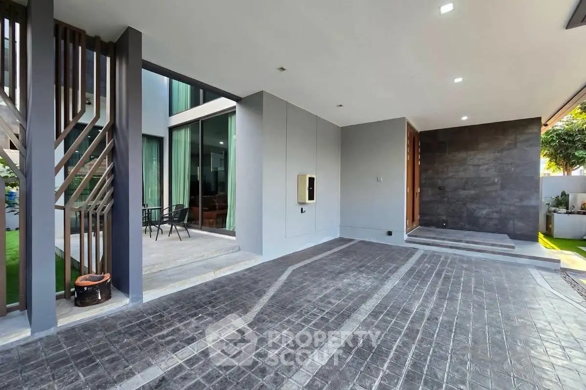 Modern home exterior with spacious driveway and stylish architectural design.