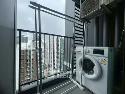 Modern balcony with washing machine and city view, perfect for urban living.