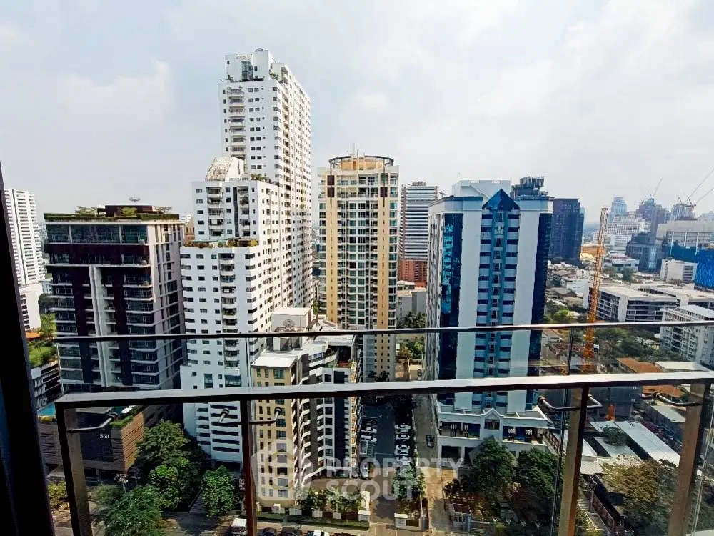 Stunning cityscape view from high-rise balcony showcasing modern urban living.