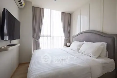 Modern bedroom with elegant decor and large window