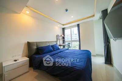 Modern bedroom with large window and stylish decor in urban apartment