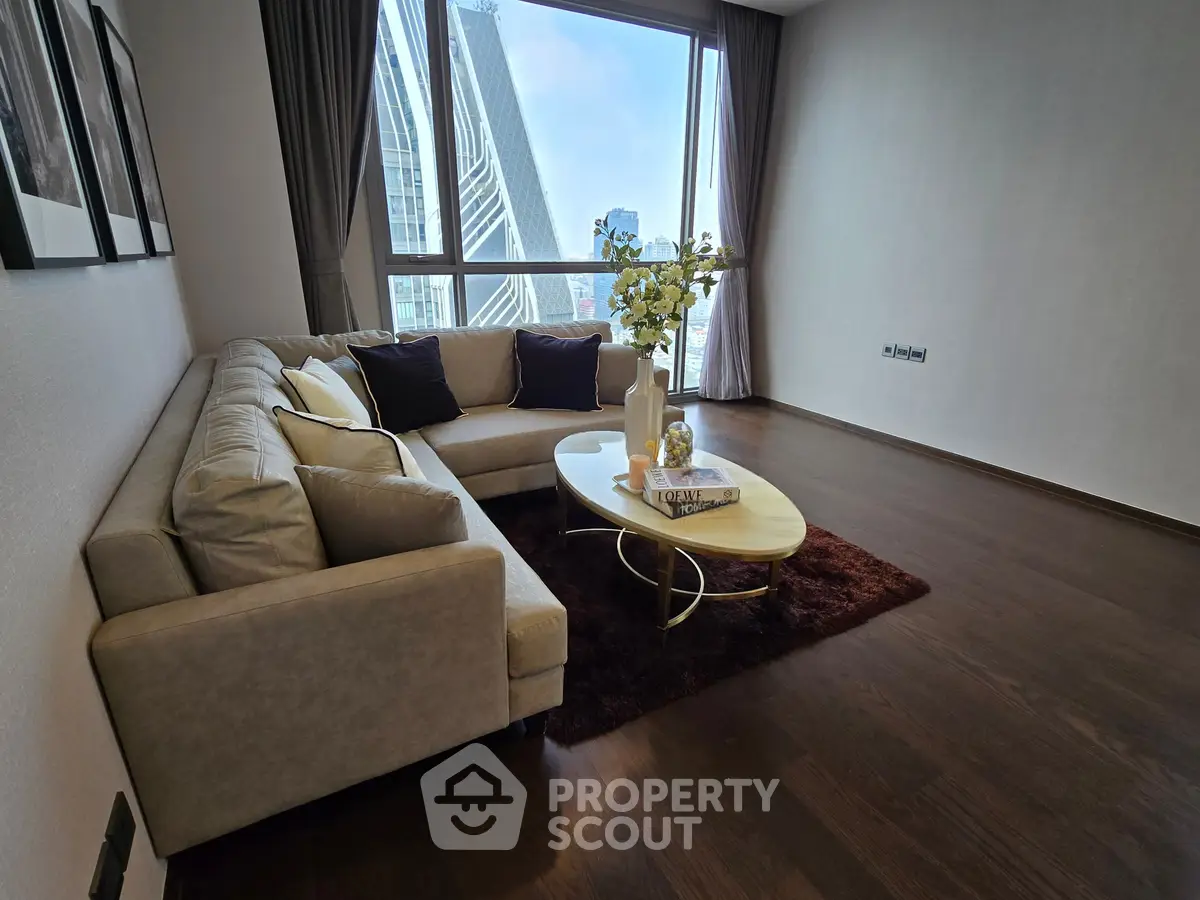 Elegant living room with modern sofa and city view, perfect for urban living.