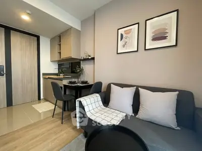 Modern living room with cozy sofa and dining area in stylish apartment