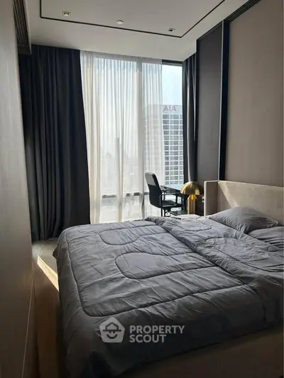 Modern bedroom with large window and city view, featuring sleek furniture and elegant design.