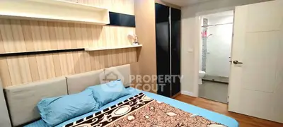 Cozy bedroom with modern design and ensuite bathroom, featuring stylish decor and ample storage.