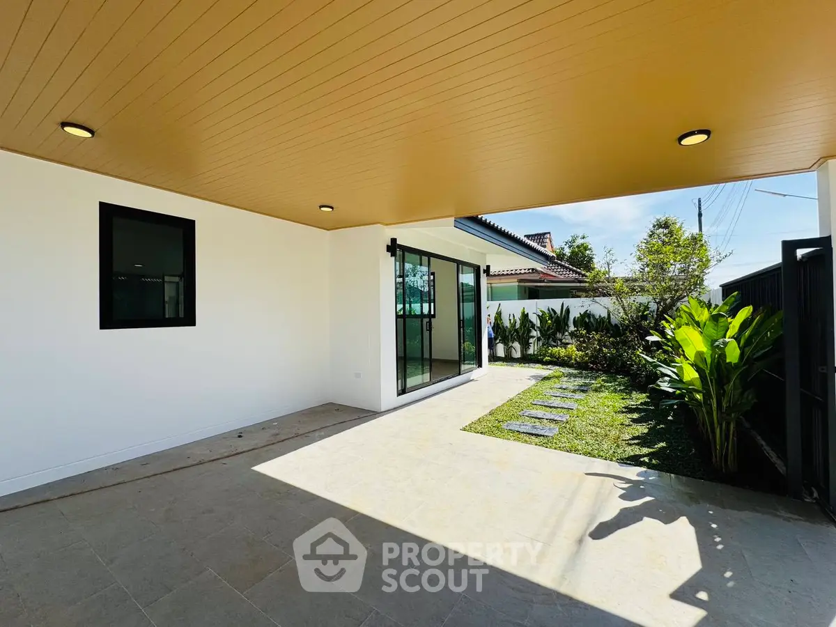 Modern home with spacious covered patio and lush garden