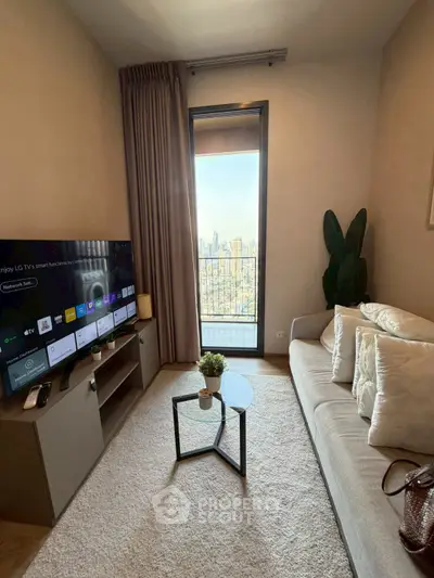 Modern living room with balcony and city view, featuring sleek furniture and a large TV.