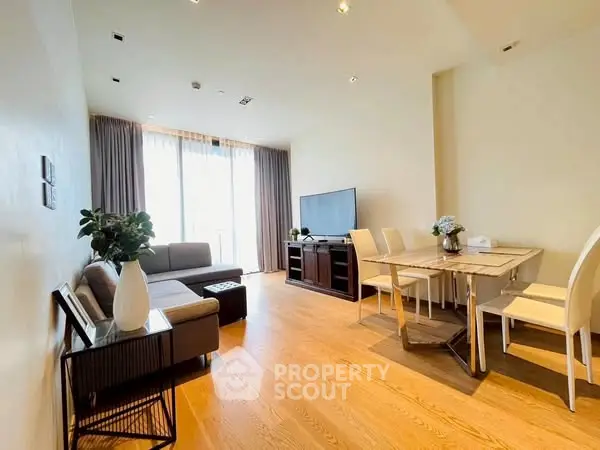 Spacious modern living room with elegant dining area and natural light