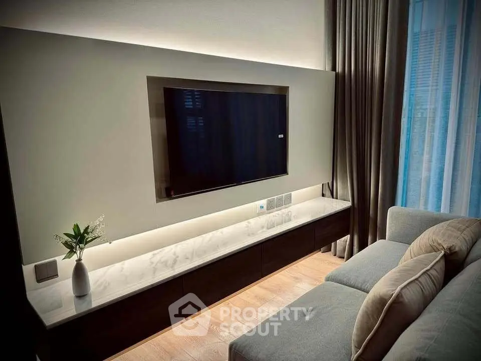 Modern living room with sleek TV setup and elegant decor