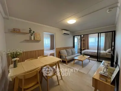 Charming open-plan living room with cozy dining area and modern decor