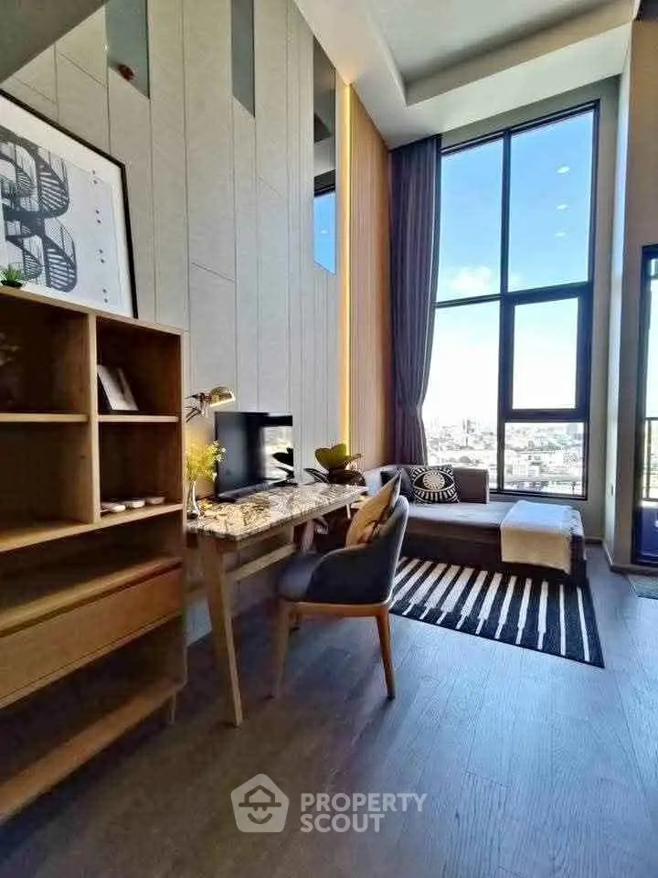 Luxurious modern living room with high ceilings and large windows offering stunning city views.