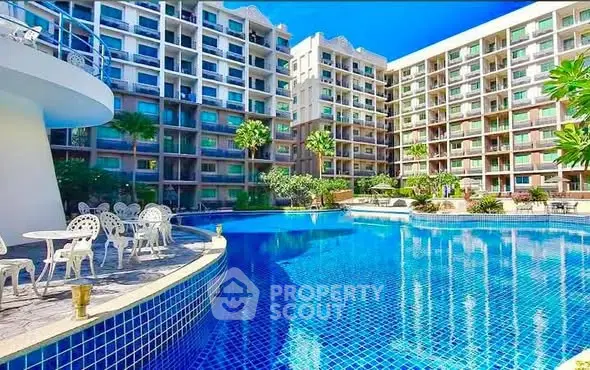 Luxurious residential complex with stunning pool and modern architecture.