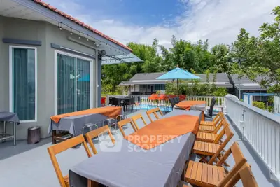 Spacious balcony with outdoor dining area and scenic view
