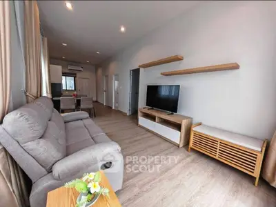 Spacious modern living room with sleek furniture and open layout