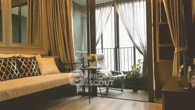 Stylish living room with balcony access and elegant decor