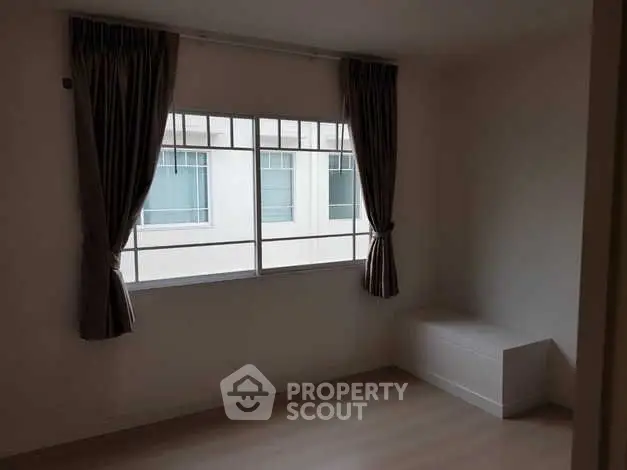 Minimalist empty room with large window and curtains, perfect for customization.