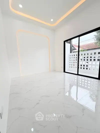 Modern minimalist room with marble flooring and large window for natural light.