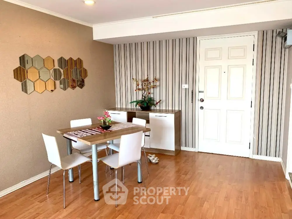 Charming dining area with modern decor and wooden flooring