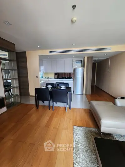 Spacious open-plan living room with modern kitchen and dining area