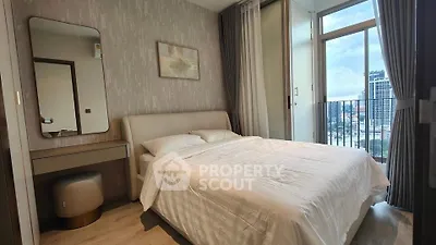 Modern bedroom with city view and stylish decor in high-rise apartment