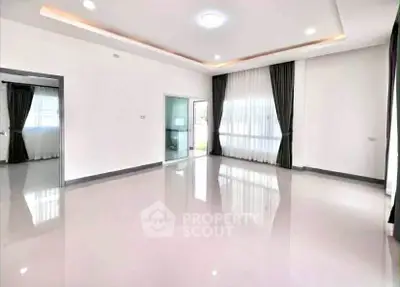 Spacious modern living room with glossy floors and large windows