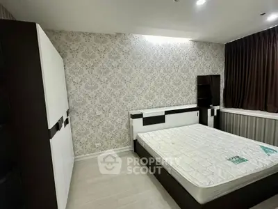 Modern bedroom with stylish wallpaper and sleek furniture design