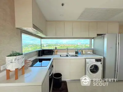 Modern kitchen with panoramic window and sleek appliances