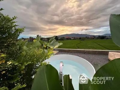 Stunning rooftop view with lush greenery and serene landscape