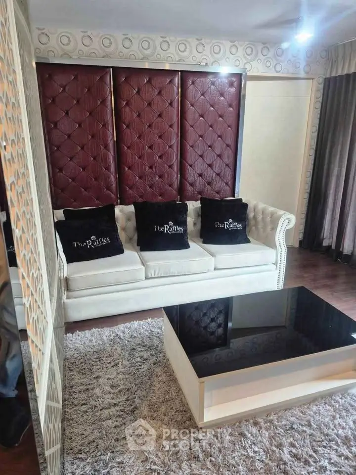 Luxurious living room with elegant sofa and modern coffee table in stylish apartment.